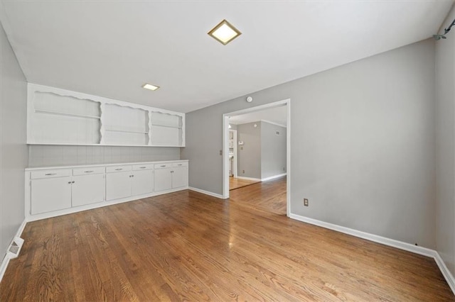 2015 Somerset Dr, Prairie Village, KS 66206 - spare room featuring light wood finished floors and baseboards