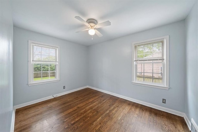 2015 Somerset Dr, Prairie Village, KS 66206 - unfurnished room with plenty of natural light, dark wood-type flooring, baseboards, and a ceiling fan