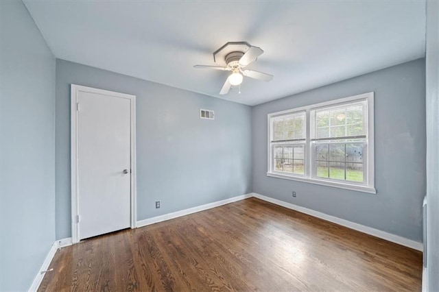 2015 Somerset Dr, Prairie Village, KS 66206 - spare room featuring ceiling fan, baseboards, and dark wood-style floors
