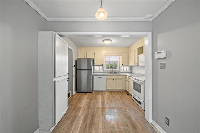 2015 Somerset Dr, Prairie Village, KS 66206 - kitchen featuring white appliances, a sink, light wood finished floors, light countertops, and ornamental molding