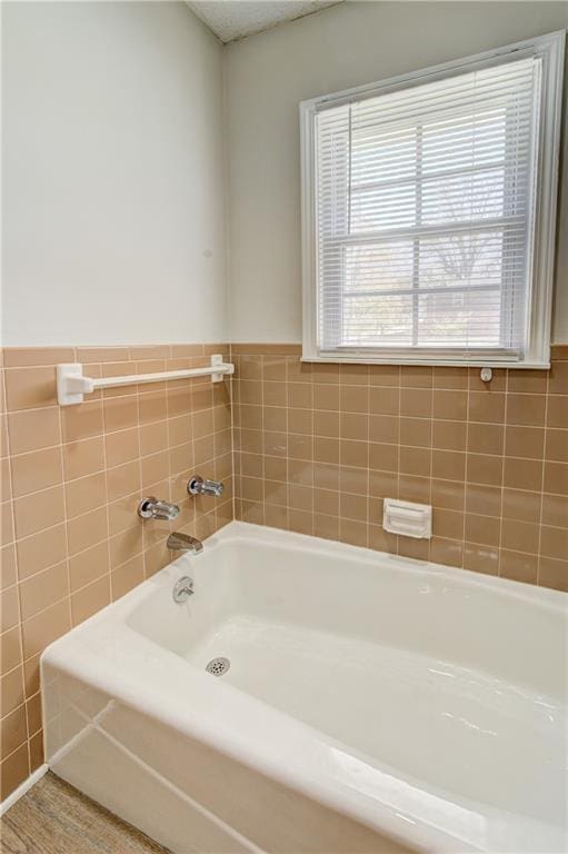 full bathroom with a bath