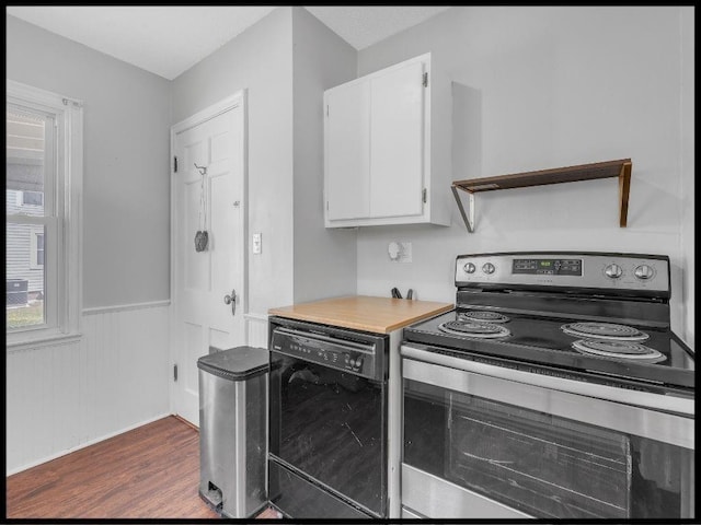 165 S Miami Ave, Marshall, MO 65340 - kitchen featuring electric stove, light countertops, white cabinets, a wainscoted wall, and dishwasher