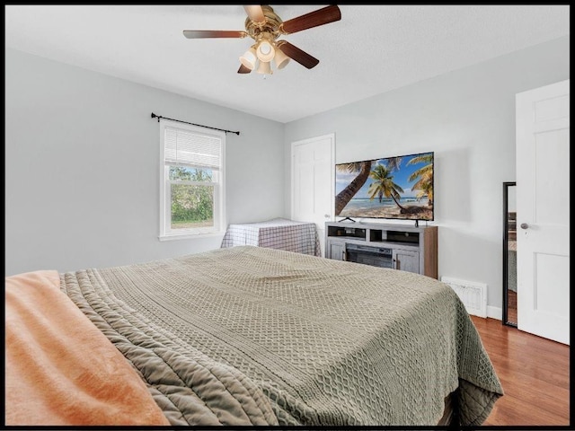 165 S Miami Ave, Marshall, MO 65340 - bedroom with a ceiling fan, visible vents, and wood finished floors