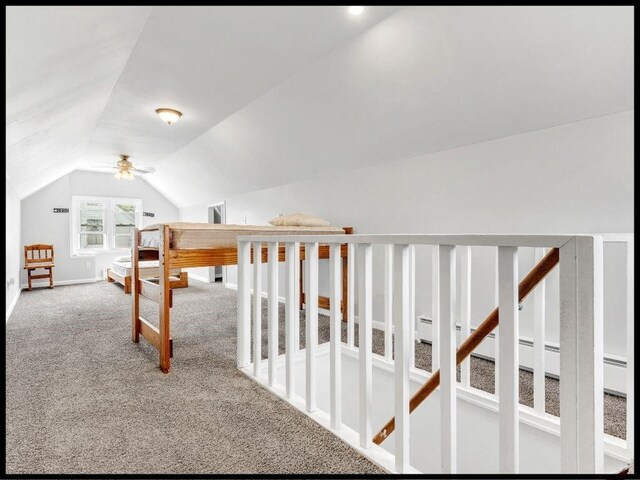 165 S Miami Ave, Marshall, MO 65340 - interior space featuring baseboards, lofted ceiling, and carpet