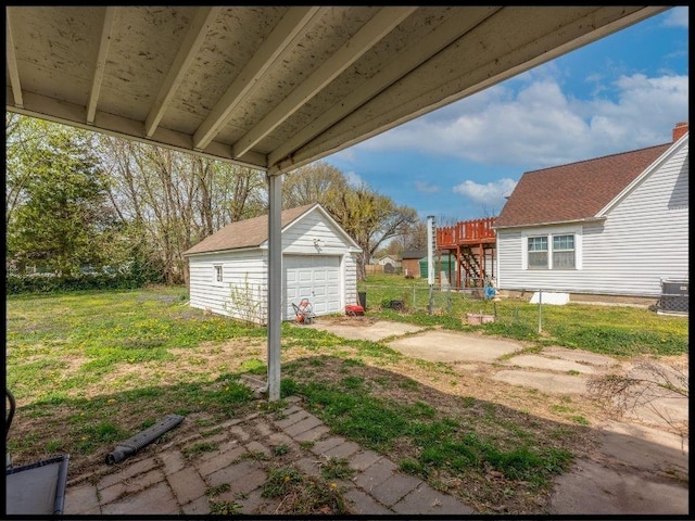 165 S Miami Ave, Marshall, MO 65340 - view of yard with central air condition unit, fence, an outbuilding, and a garage