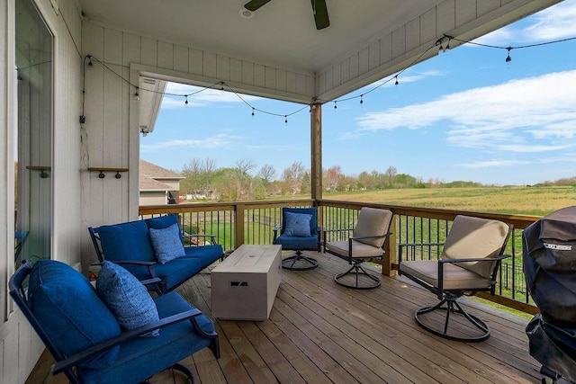 1904 NE 114th Ter, Kansas City, MO 64155 - deck with outdoor lounge area and a ceiling fan