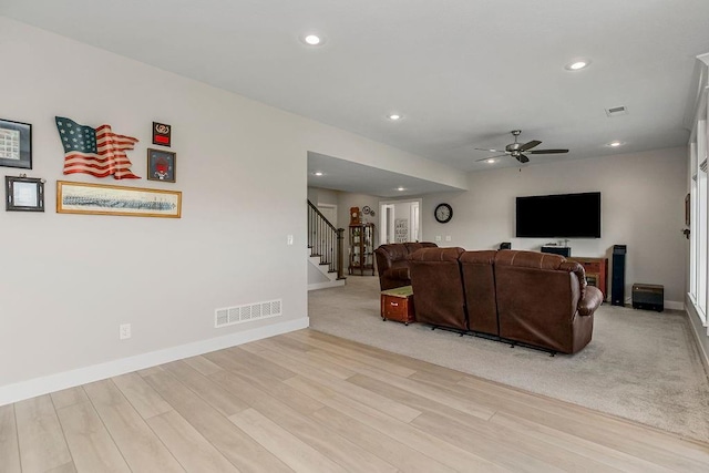 1904 NE 114th Ter, Kansas City, MO 64155 - living room featuring visible vents, a ceiling fan, recessed lighting, wood finished floors, and stairs