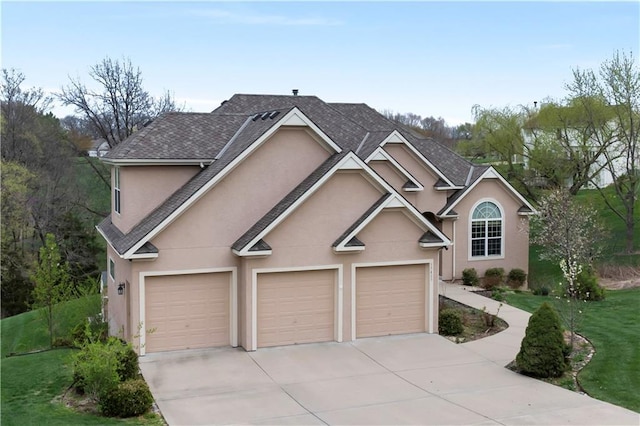 traditional-style house featuring a front yard, stucco siding, and concrete driveway