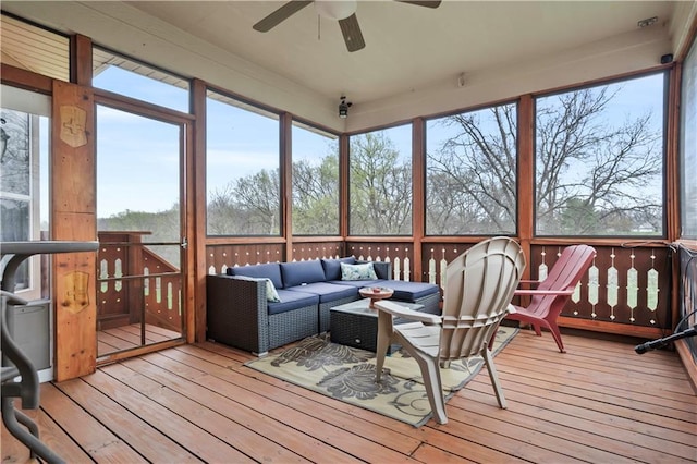 sunroom featuring an outdoor living space and ceiling fan