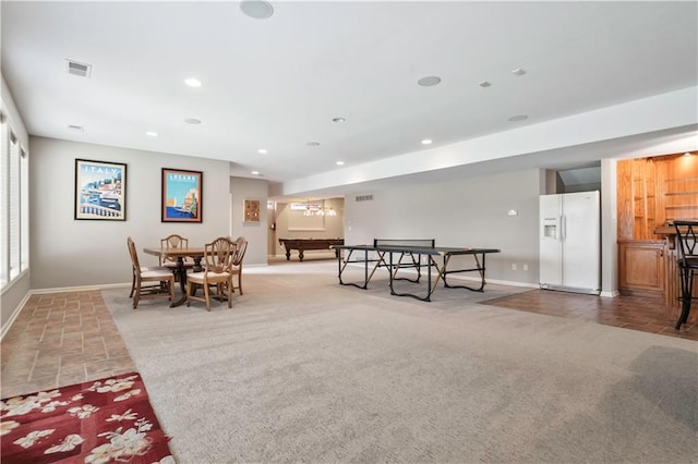 dining area featuring visible vents, baseboards, recessed lighting, and light colored carpet