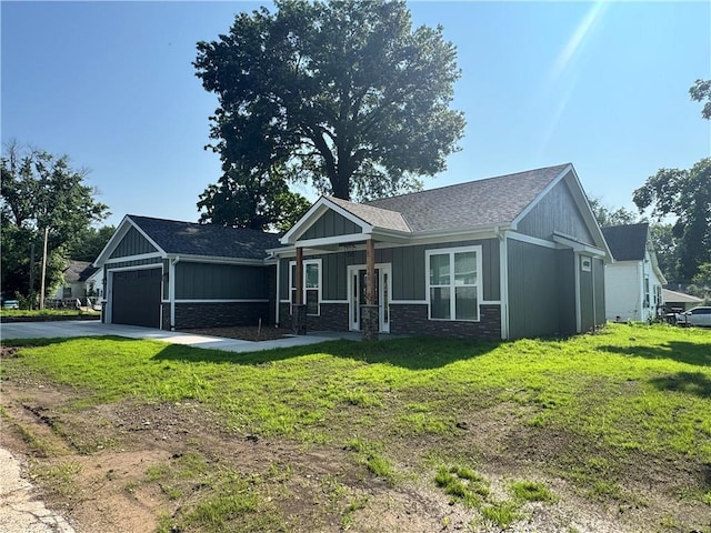 101 N Maple St, Butler, MO 64730 - view of front of house with a garage, concrete driveway, a front yard, and board and batten siding