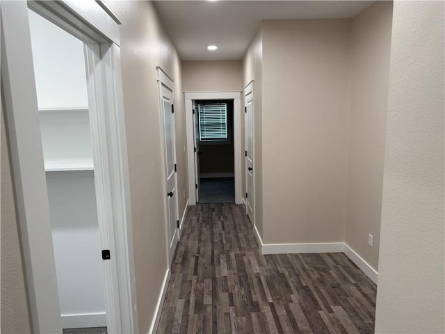 101 N Maple St, Butler, MO 64730 - corridor featuring dark wood-style flooring, baseboards, and recessed lighting