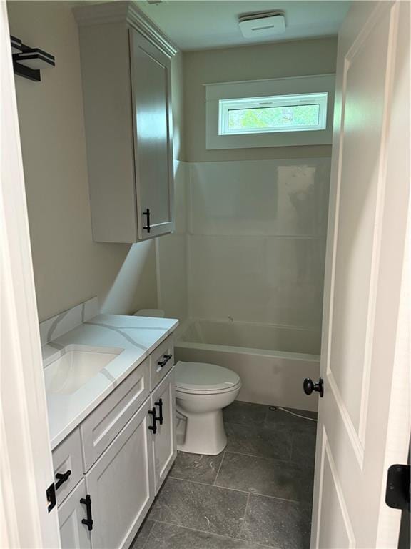101 N Maple St, Butler, MO 64730 - full bath featuring vanity, toilet, and stone finish flooring