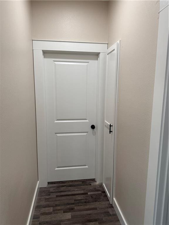 101 N Maple St, Butler, MO 64730 - detailed view of wood finished floors and baseboards