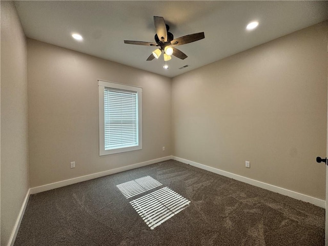 101 N Maple St, Butler, MO 64730 - unfurnished room featuring dark carpet, ceiling fan, baseboards, and recessed lighting