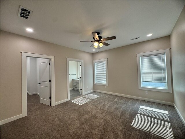 101 N Maple St, Butler, MO 64730 - unfurnished bedroom with carpet floors, baseboards, recessed lighting, a ceiling fan, and ensuite bath