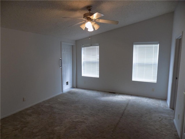 518 S Pine, Ottawa, KS 66067 - carpeted spare room with a textured ceiling, ceiling fan, and vaulted ceiling
