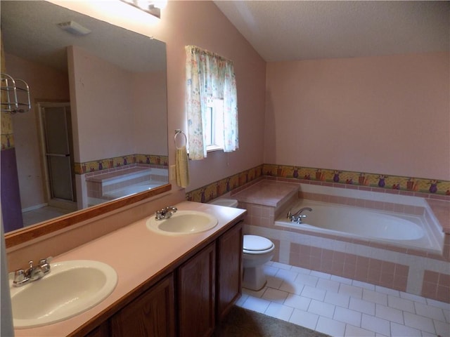 518 S Pine, Ottawa, KS 66067 - bathroom featuring a sink, tile patterned floors, double vanity, and vaulted ceiling