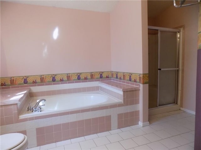 518 S Pine, Ottawa, KS 66067 - bathroom with toilet, tile patterned floors, a bath, and a shower stall