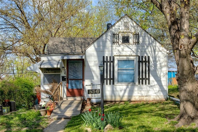 view of front of property featuring roof with shingles