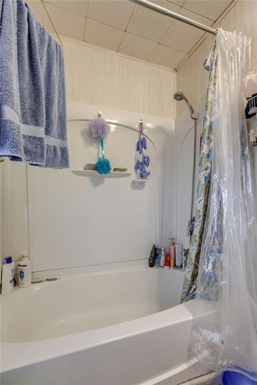 bathroom featuring shower / bathtub combination with curtain