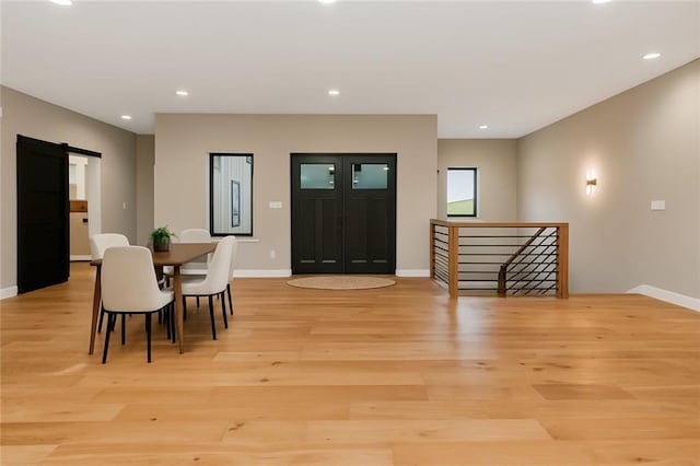 284 SW 1311th Rd, Holden, MO 64040 - dining area featuring light wood-style floors, baseboards, a barn door, and recessed lighting