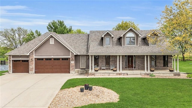 view of front of property with a shingled roof, a front lawn, a garage, a porch, and concrete driveway