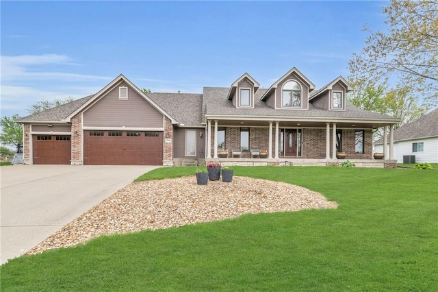 view of front of house with an attached garage, driveway, brick siding, and a front yard