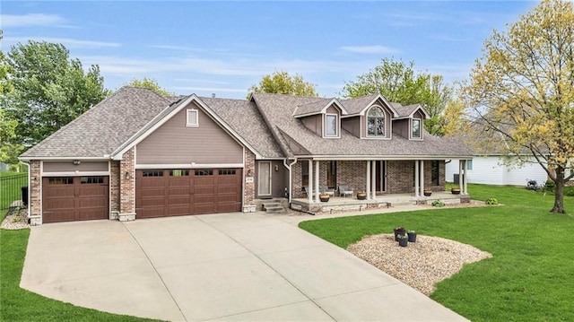 view of front facade with a garage, a front lawn, covered porch, brick siding, and driveway