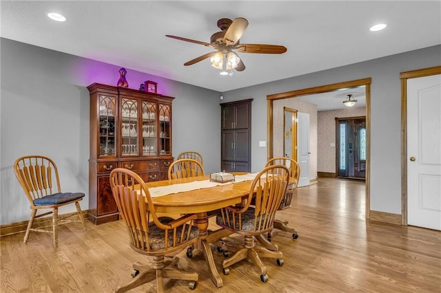 dining space featuring light wood-style floors, baseboards, ceiling fan, and recessed lighting