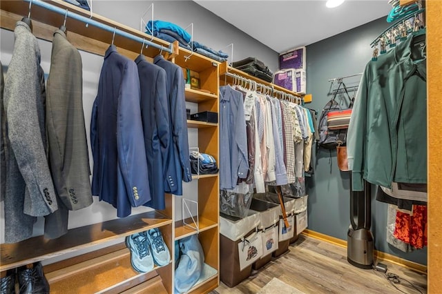 spacious closet featuring wood finished floors