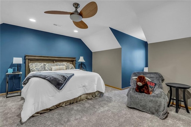 bedroom with visible vents, carpet, baseboards, and vaulted ceiling