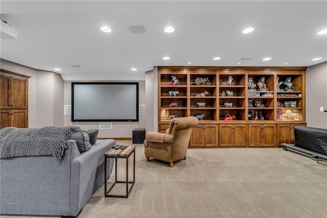cinema with recessed lighting and light carpet