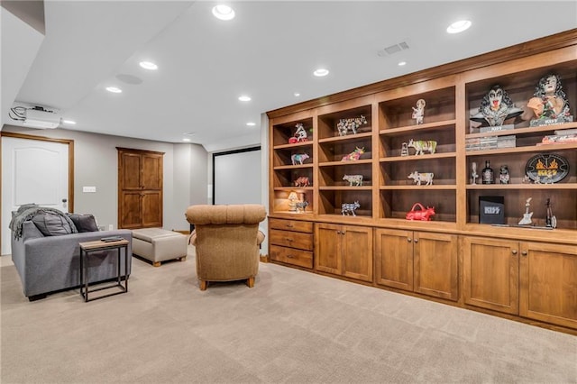 sitting room featuring recessed lighting, visible vents, and light carpet