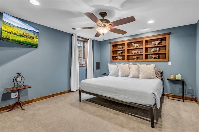 bedroom featuring baseboards, light carpet, a ceiling fan, and visible vents
