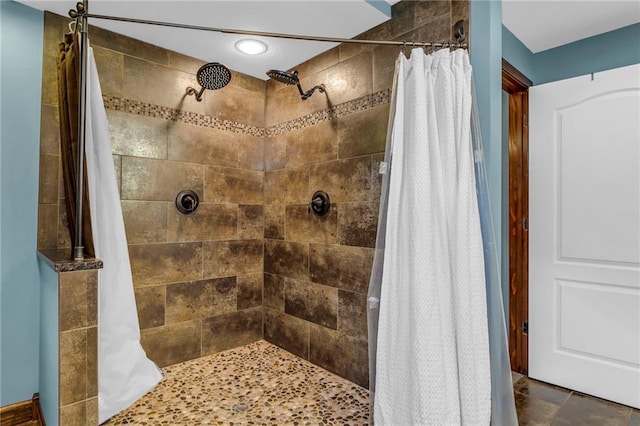 full bath featuring a tile shower