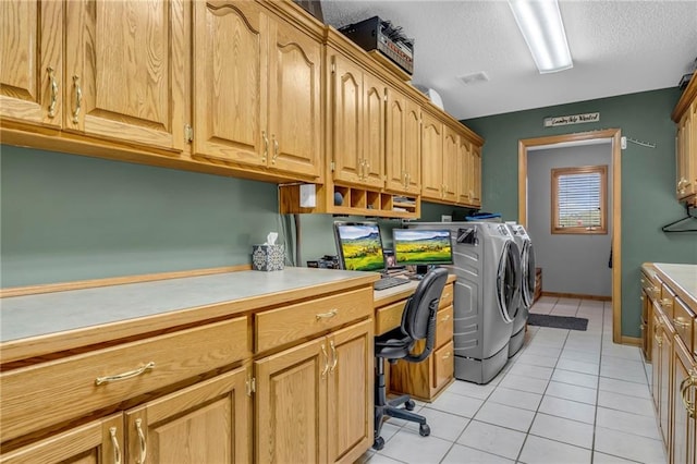 laundry area featuring a textured ceiling, visible vents, washing machine and dryer, cabinet space, and light tile patterned flooring