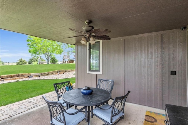 view of patio featuring ceiling fan and outdoor dining space