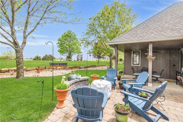 view of patio with an outdoor fire pit
