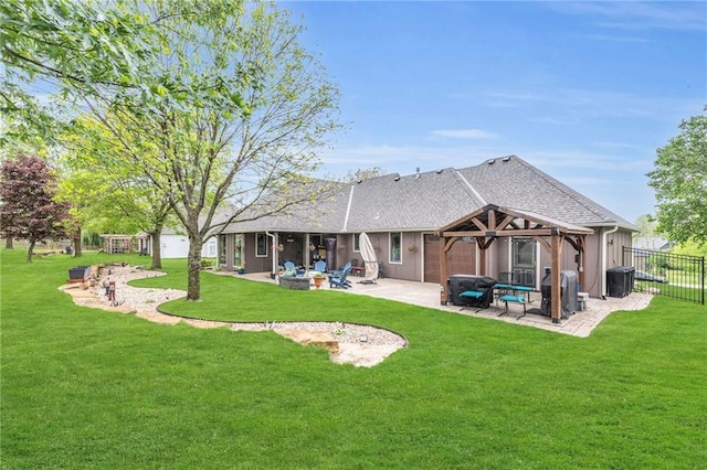 back of house with an outdoor living space with a fire pit, central AC, fence, a patio area, and a lawn