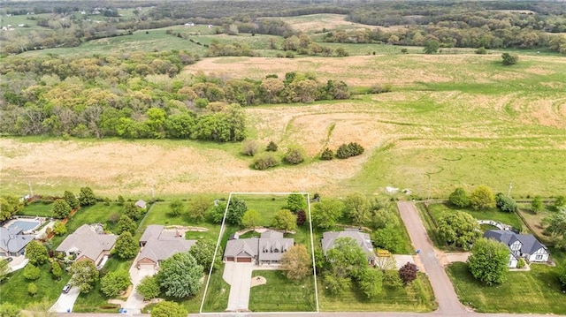 drone / aerial view featuring a rural view and a residential view