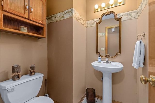 808 S Mohican Dr, Independence, MO 64056 - bathroom featuring a sink and toilet