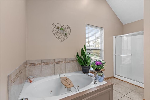 808 S Mohican Dr, Independence, MO 64056 - bathroom with a shower stall, tile patterned flooring, a tub with jets, and lofted ceiling