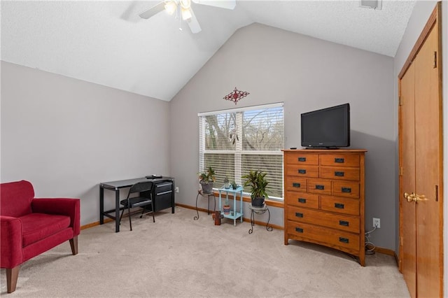 808 S Mohican Dr, Independence, MO 64056 - living area with baseboards, a ceiling fan, carpet, a textured ceiling, and vaulted ceiling