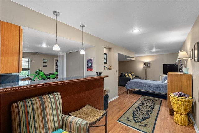 808 S Mohican Dr, Independence, MO 64056 - bedroom with baseboards and light wood-style floors