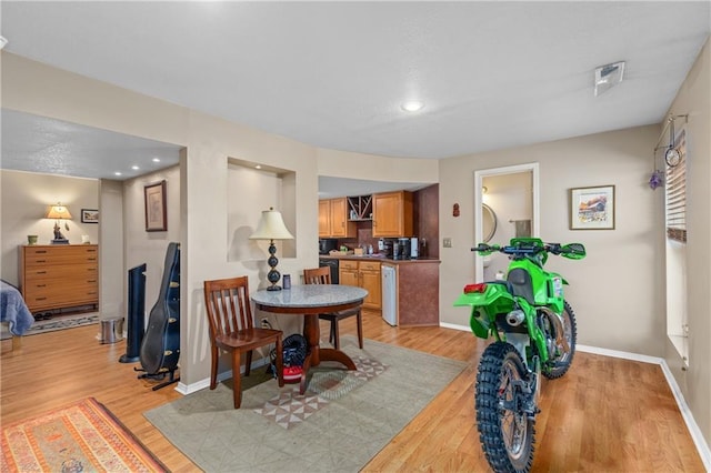 808 S Mohican Dr, Independence, MO 64056 - dining area with light wood-style flooring and baseboards
