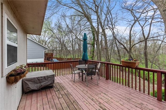 808 S Mohican Dr, Independence, MO 64056 - wooden deck with outdoor dining space