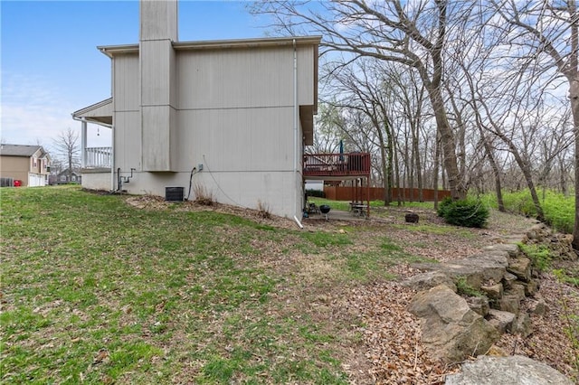 808 S Mohican Dr, Independence, MO 64056 - view of side of home with a yard and central AC