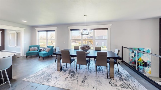 dining room featuring recessed lighting and an inviting chandelier