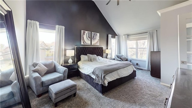 carpeted bedroom with high vaulted ceiling and baseboards